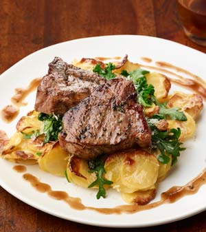 Honey-brined Aussie Lamb T-bones with Roasted Poblano au Gratin Potatoes, Garlicky Greens, Apple Butter Pan Jus